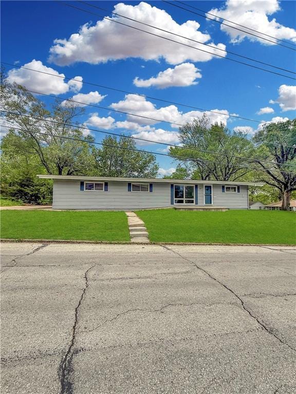 ranch-style house with a front yard