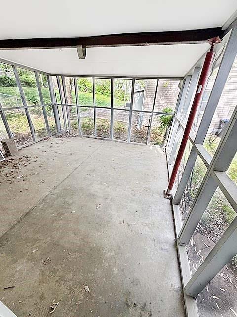 unfurnished sunroom with a wealth of natural light