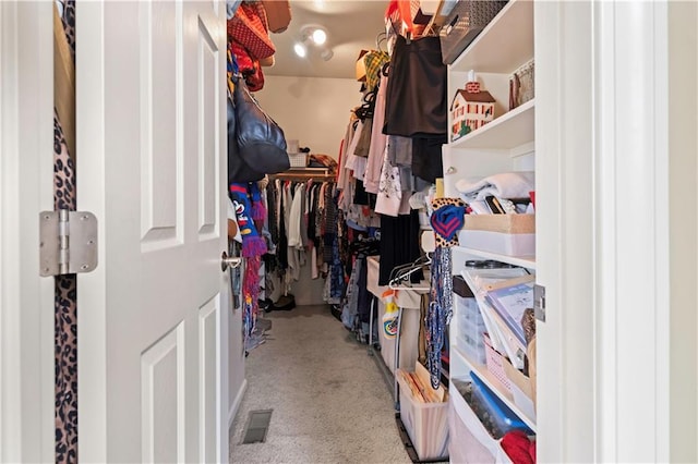 walk in closet with carpet floors and visible vents