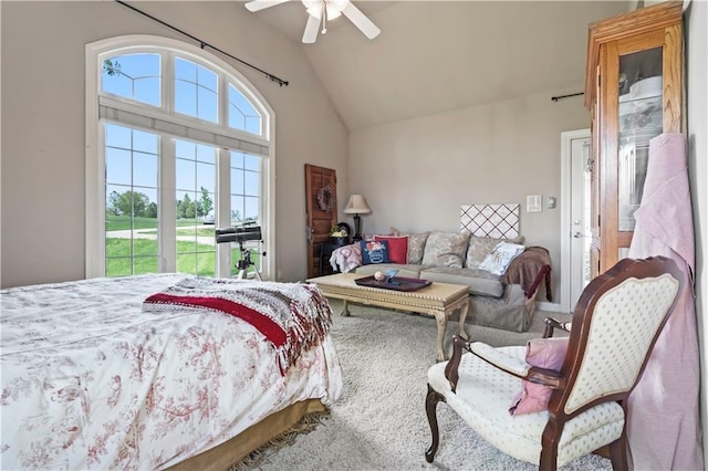 bedroom featuring high vaulted ceiling, a ceiling fan, and carpet