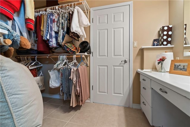 walk in closet featuring light tile patterned floors