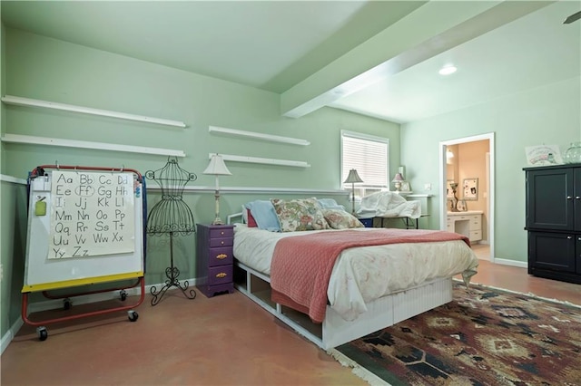 bedroom with ensuite bath, baseboards, and beam ceiling