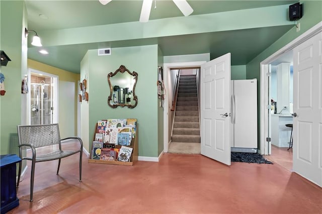 living area with recessed lighting, visible vents, a ceiling fan, baseboards, and stairs