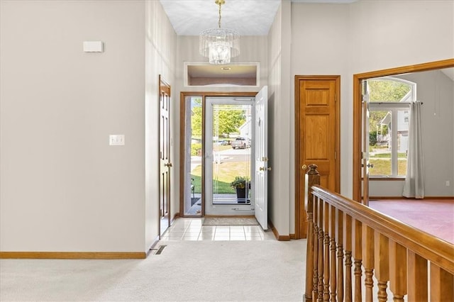 22716 E 29th Street Lane Ct S, Blue Springs, MO 64015 - entrance foyer featuring a chandelier, baseboards, and light carpet