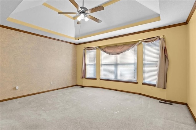 22716 E 29th Street Lane Ct S, Blue Springs, MO 64015 - carpeted spare room featuring a tray ceiling, ornamental molding, baseboards, and ceiling fan