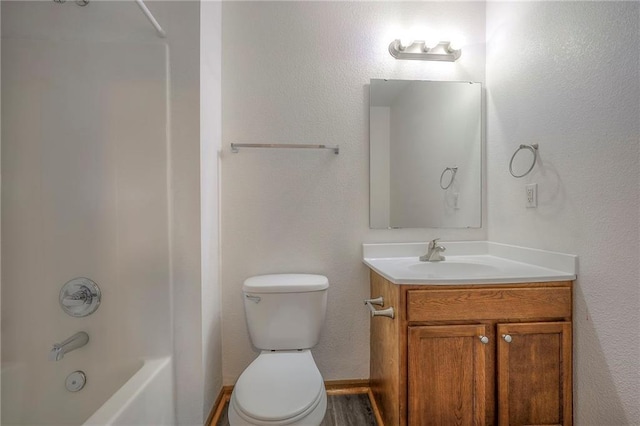 full bath featuring toilet,  shower combination, and vanity