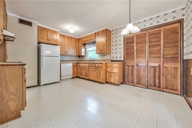 kitchen featuring visible vents, crown molding, ventilation hood, wallpapered walls, and white appliances