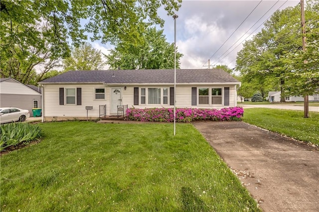ranch-style home with a front yard