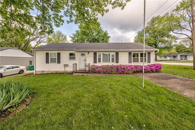 ranch-style home with a front lawn