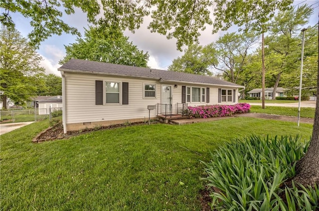 ranch-style house featuring fence, a front lawn, and crawl space
