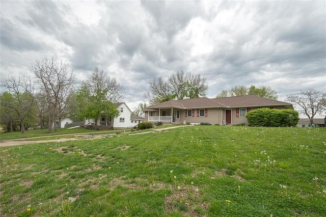 ranch-style house featuring a front lawn
