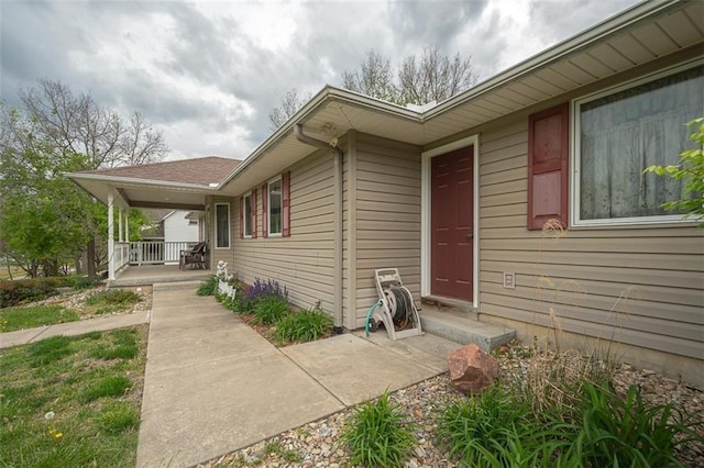 doorway to property with covered porch
