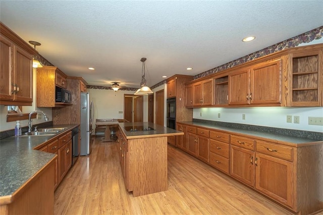 kitchen featuring open shelves, dark countertops, a sink, a kitchen island, and black appliances