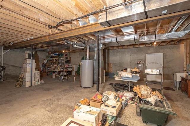 unfinished basement featuring water heater