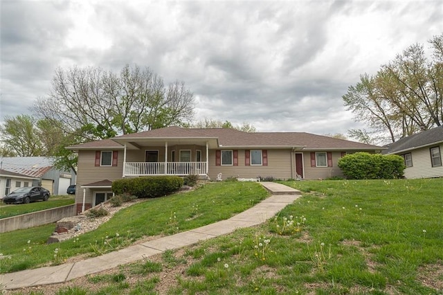 single story home with a porch and a front lawn