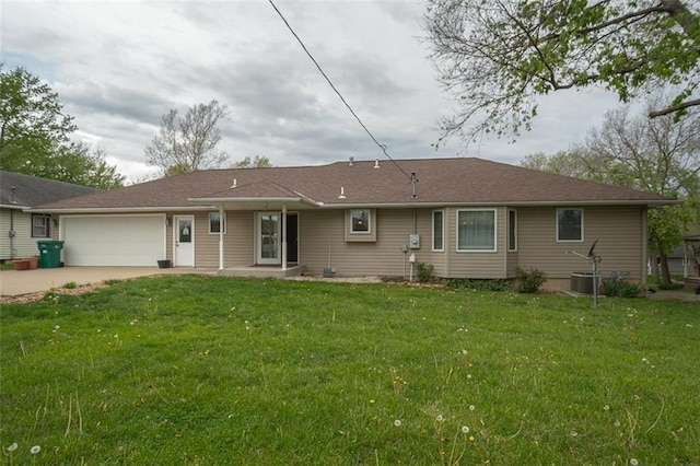 view of front of house featuring a garage, a front yard, and concrete driveway