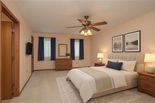 915 Walnut St, Valley Falls, KS 66088 - bedroom featuring baseboards, light carpet, and a ceiling fan