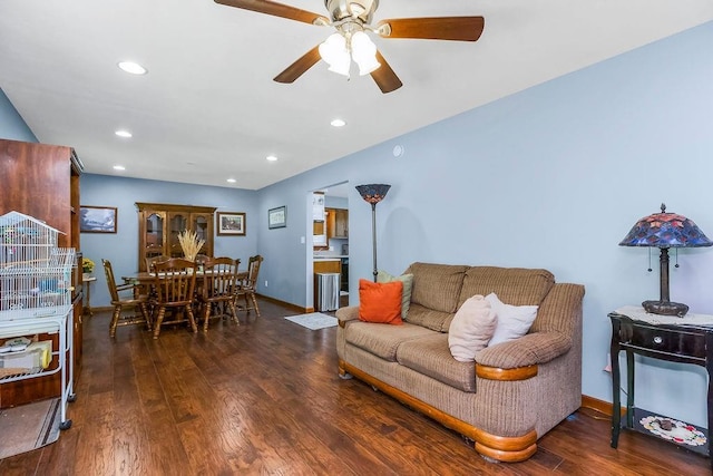 living room featuring a ceiling fan, baseboards, wood finished floors, and recessed lighting