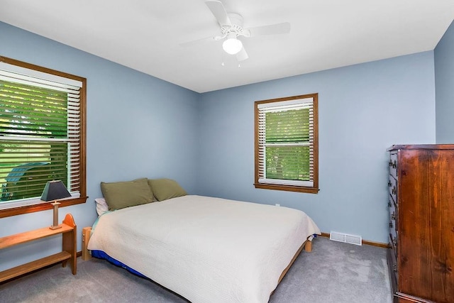 bedroom with carpet, baseboards, and a ceiling fan