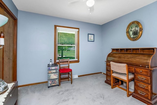 home office featuring a ceiling fan, carpet, and baseboards