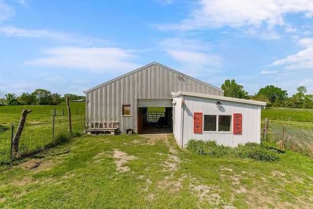 view of pole building featuring driveway