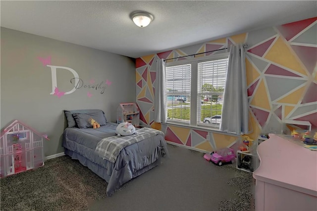bedroom with baseboards, a textured ceiling, and carpet