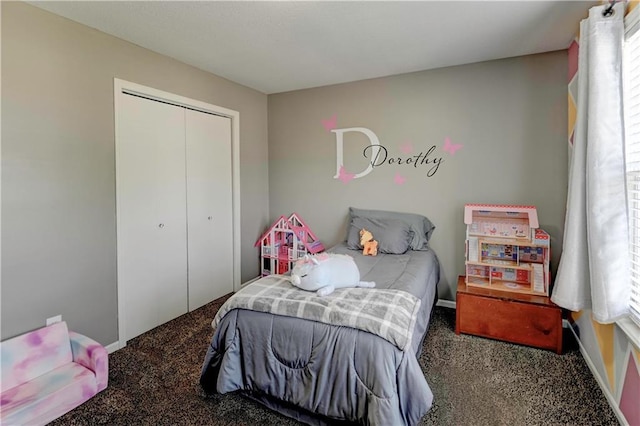 bedroom featuring a closet, carpet flooring, and baseboards