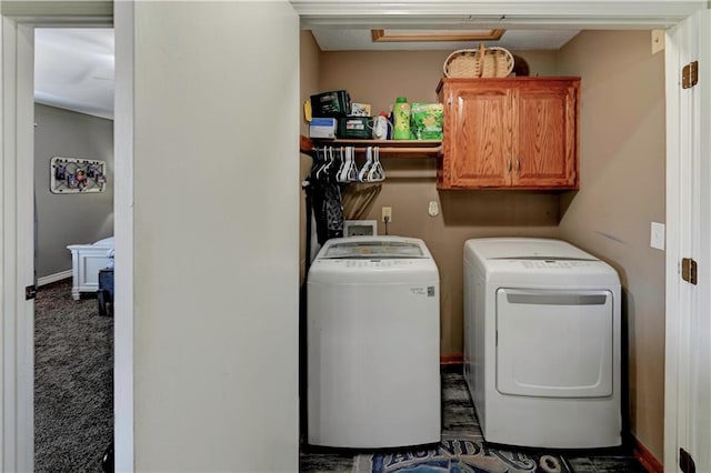 laundry room with cabinet space and washing machine and dryer