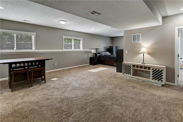 interior space with carpet floors, baseboards, and visible vents