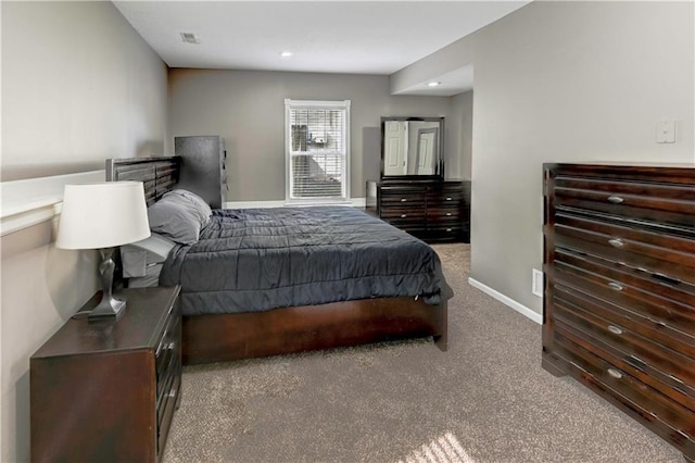 carpeted bedroom featuring recessed lighting, baseboards, and visible vents