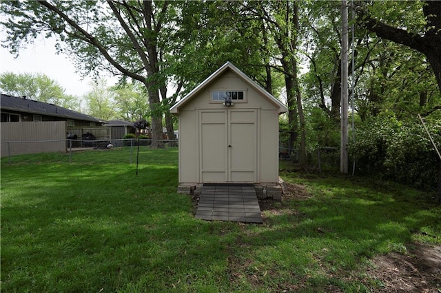 view of shed featuring a fenced backyard