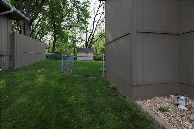 view of yard with fence and a gate