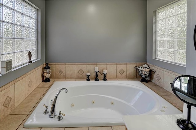 full bathroom with a jetted tub and plenty of natural light
