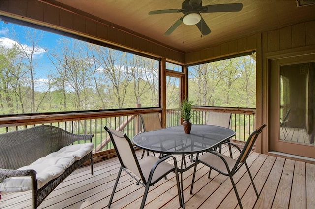 deck featuring a ceiling fan and outdoor dining space