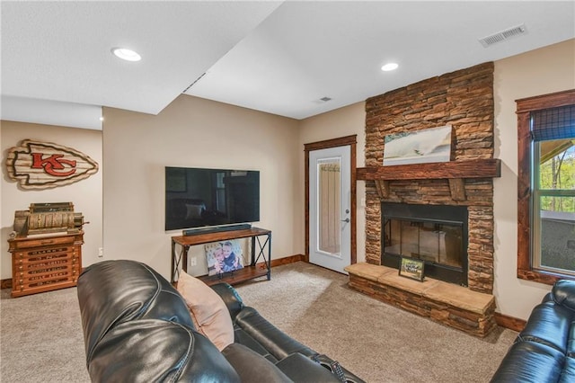 carpeted living room with visible vents, recessed lighting, baseboards, and a fireplace