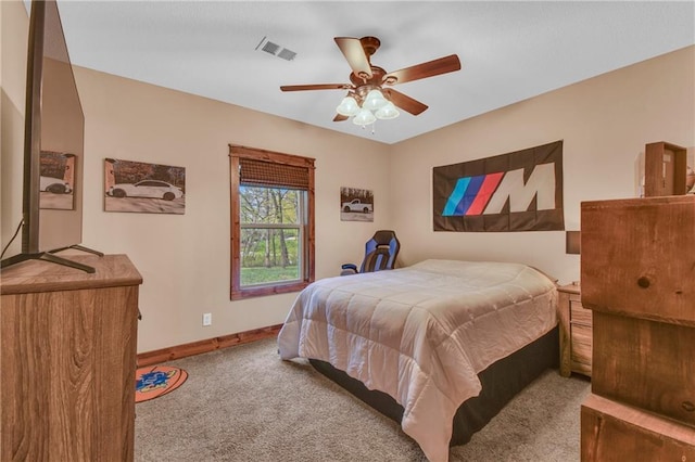 bedroom featuring carpet floors, baseboards, ceiling fan, and visible vents