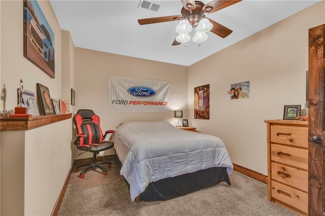 bedroom with carpet flooring, a ceiling fan, baseboards, and visible vents