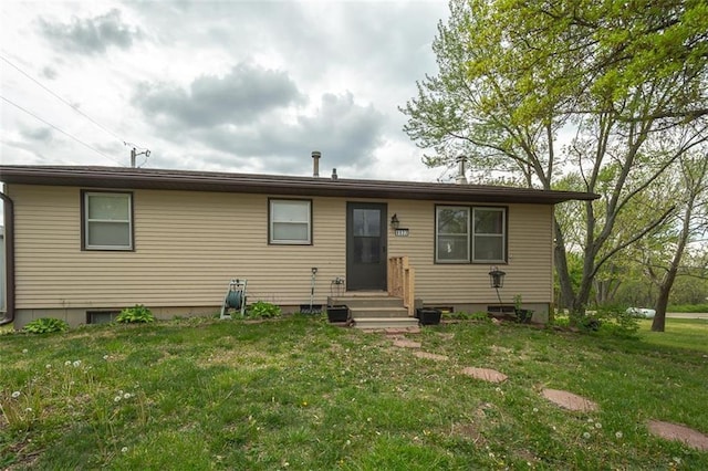 exterior space with a yard and entry steps