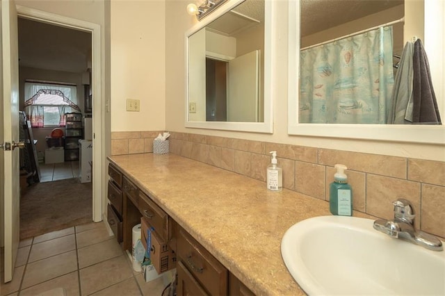 bathroom with tasteful backsplash, vanity, and tile patterned floors