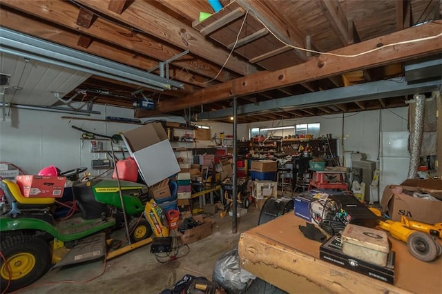 below grade area featuring freestanding refrigerator