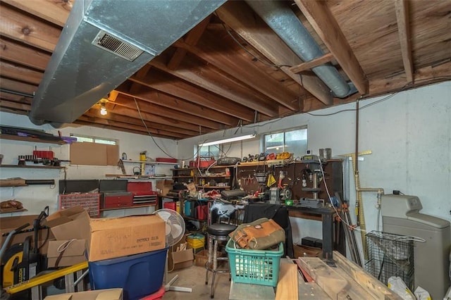 storage featuring washer / dryer and visible vents