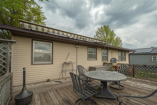 wooden deck featuring outdoor dining space