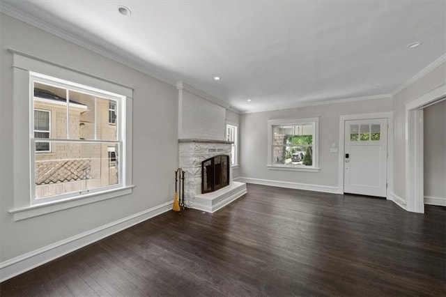 12 E 57th St, Kansas City, MO 64113 - unfurnished living room featuring dark wood-style floors, a stone fireplace, ornamental molding, baseboards, and recessed lighting