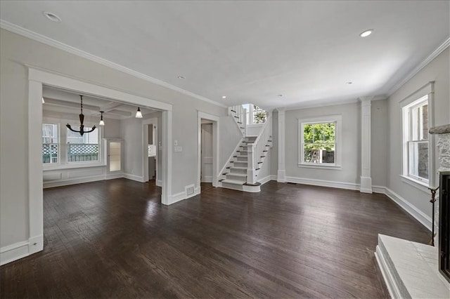 12 E 57th St, Kansas City, MO 64113 - unfurnished living room with stairs, a chandelier, wood finished floors, baseboards, and crown molding