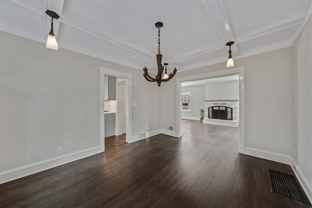 12 E 57th St, Kansas City, MO 64113 - unfurnished living room featuring coffered ceiling, dark wood-style flooring, a chandelier, beamed ceiling, and baseboards