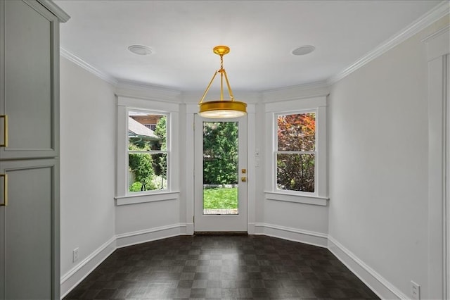12 E 57th St, Kansas City, MO 64113 - unfurnished dining area featuring healthy amount of natural light, baseboards, and crown molding