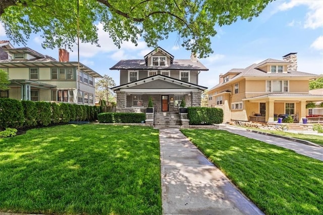 12 E 57th St, Kansas City, MO 64113 - traditional style home with covered porch, a front lawn, and stone siding