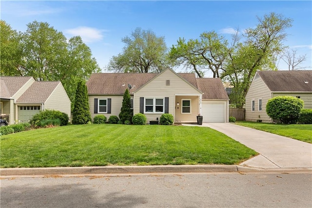 5117 W 58th St, Roeland Park, KS 66205 - view of front of home featuring a garage, a front yard, and concrete driveway
