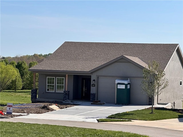 ranch-style house with stucco siding, roof with shingles, concrete driveway, and an attached garage