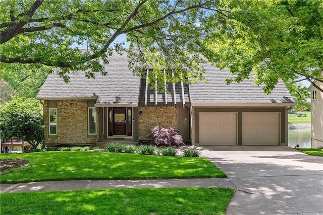 3610 NE Basswood Dr, Lees Summit, MO 64064 - view of front of home featuring stone siding, driveway, and a front yard